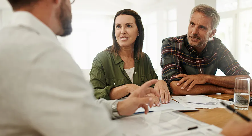 Middle aged couple meeting with advisor